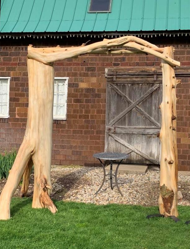 rustic tree trunk arch for wedding by old oaks vintage rentals